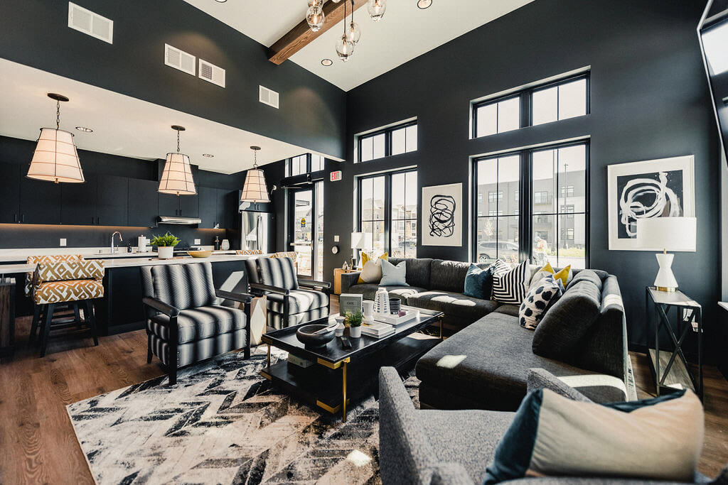 bold-living-room-black-white-design-sectioinal-open-concept-kitchen-wood-beam-celing-wisconsin-interiors