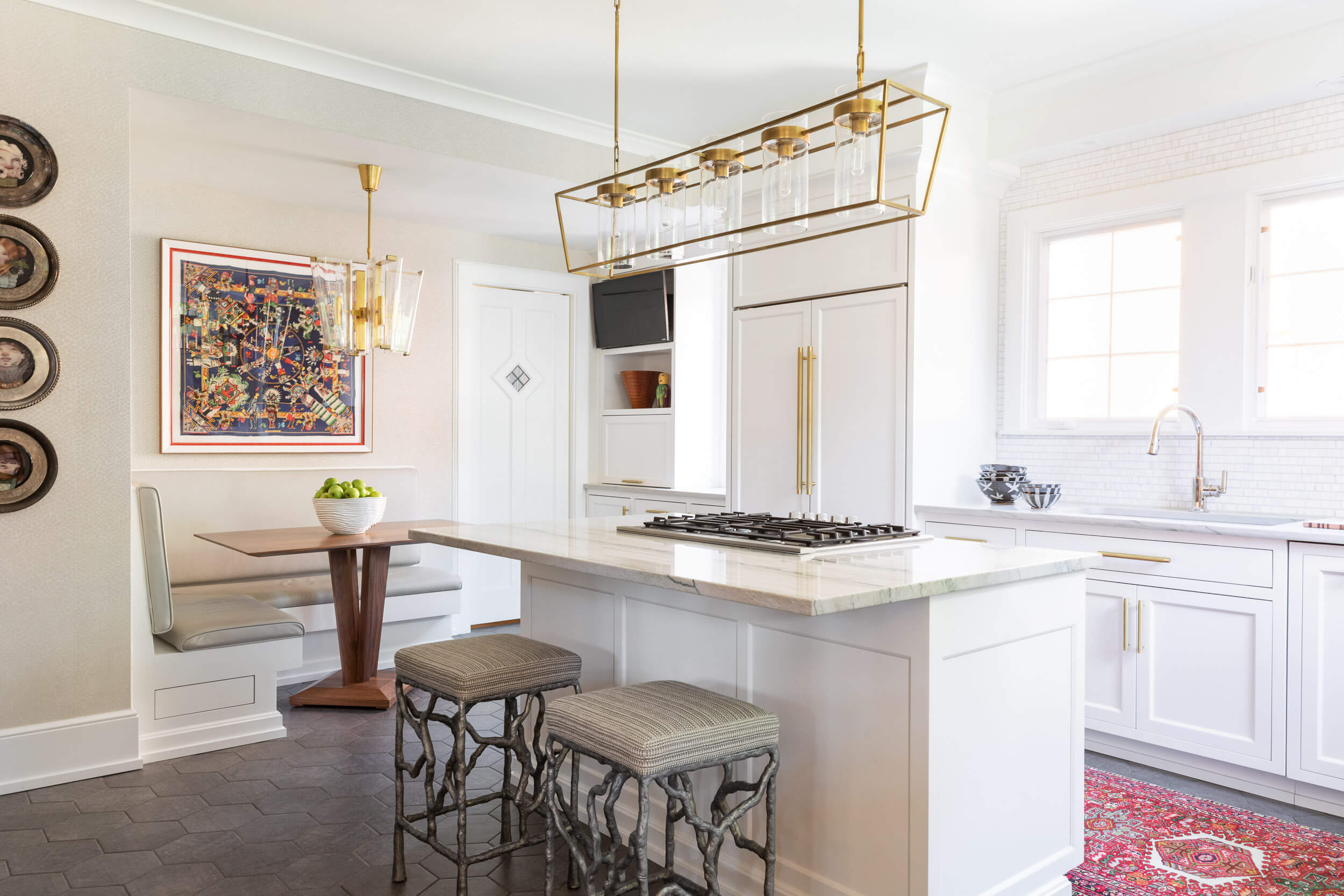 kitchen-design-inspo-gas-rang-bench-seating-breakfast-nook-cabinet-covered-refridgerator-doors-bar-stool-seats