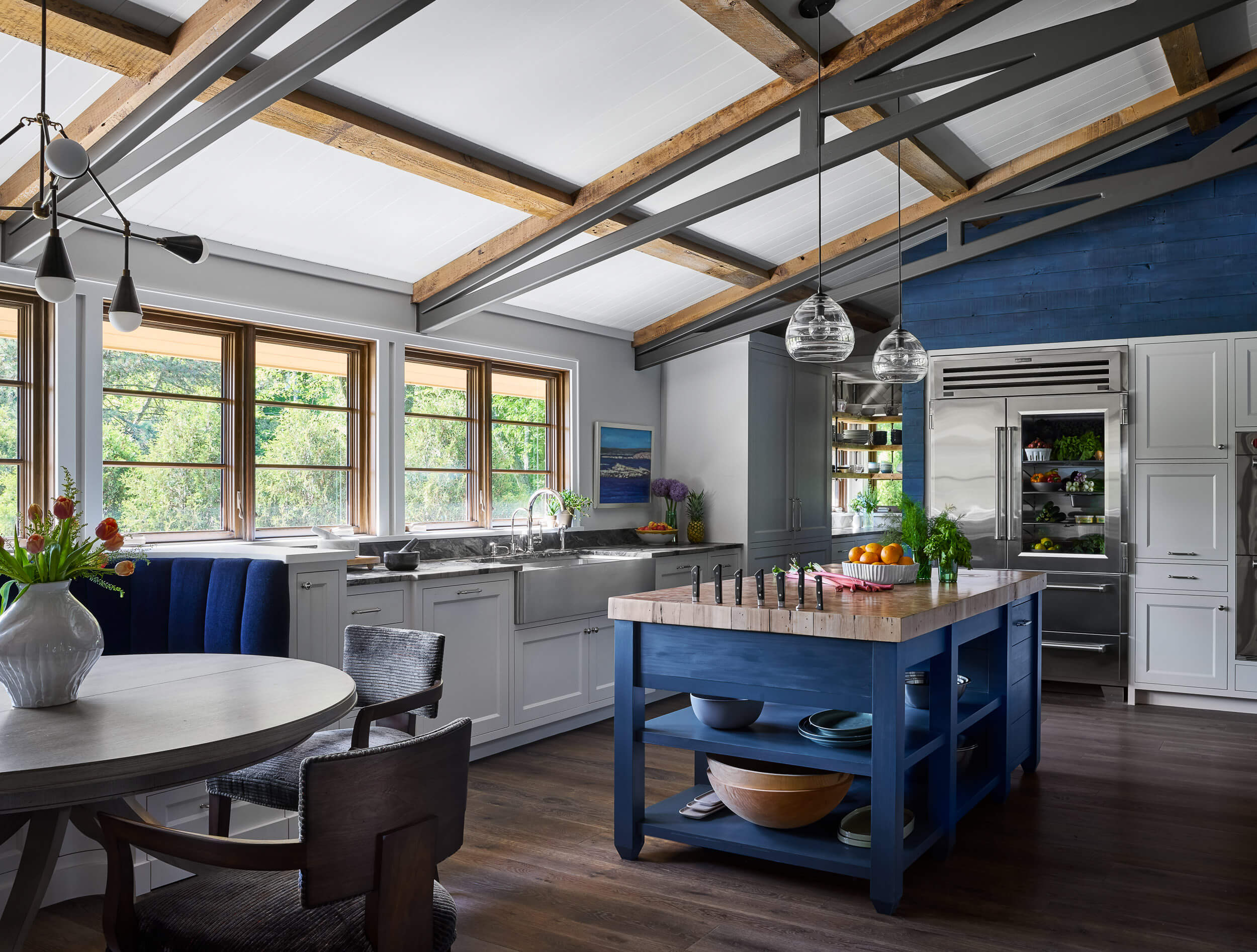 large-open-kitchen-farm-sink-open-storage-island-butcher-block-counter- wood-steel-beams-blue-wood-accent-wall-interior-design-services